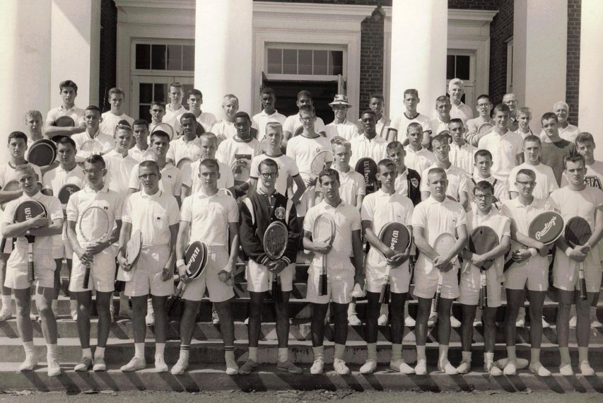 Vintage black and white photo of male tennis players posing for a group picture